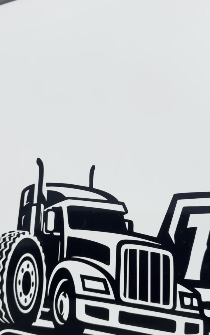 Black vinyl graphic of a semi truck tractor, front three-quarter view, on the white side of the van, cropped at the right edge